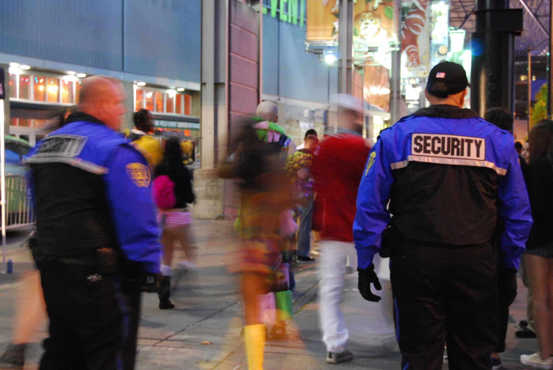 two security guards facing away