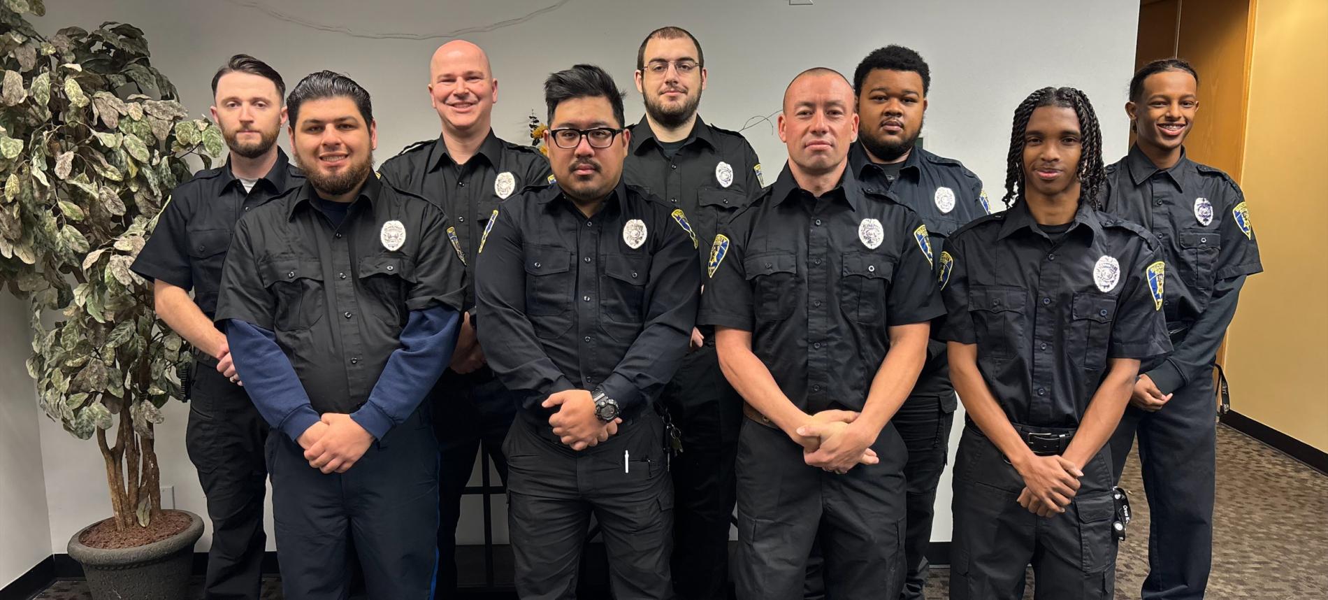 group of 9 officers in uniform