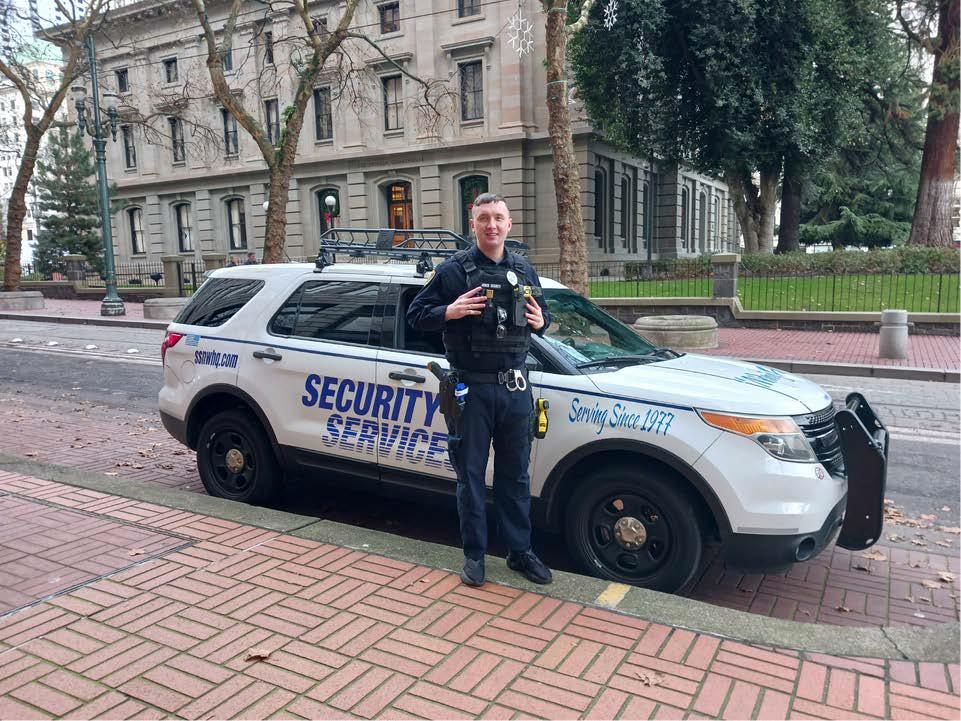 officer standing in front of patrol vehicle