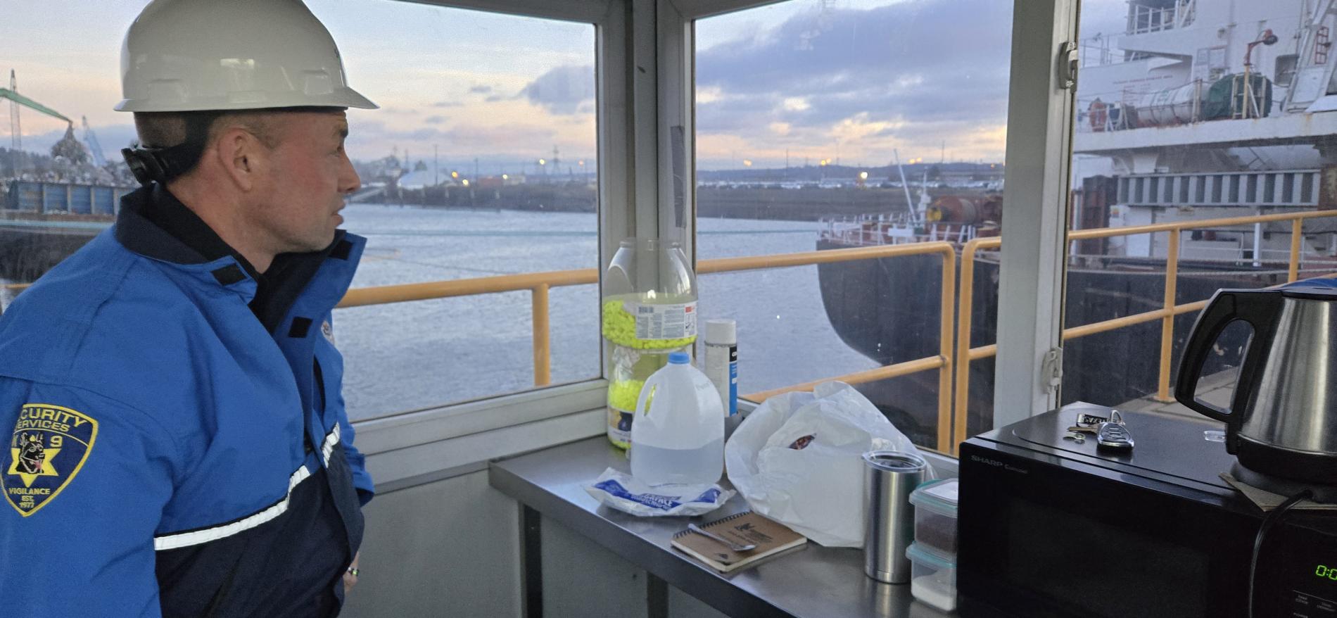 maritime security officer looking out at boat