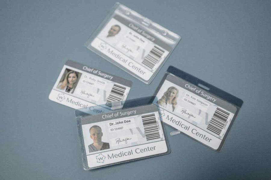 four id badges for doctors at a medical center