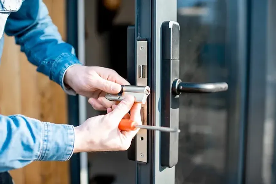 close up of hands working on door handles