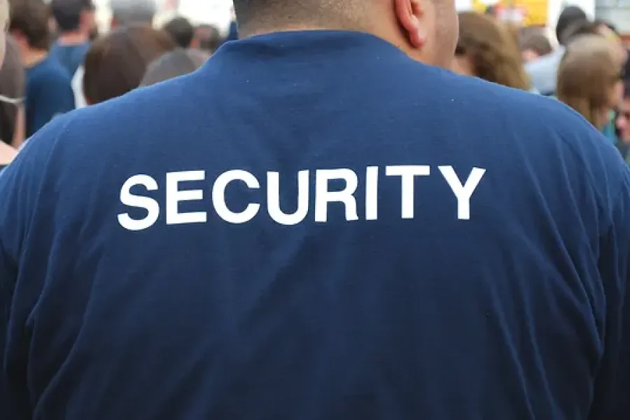 back of security officer shirt with text "security" written in capital letters