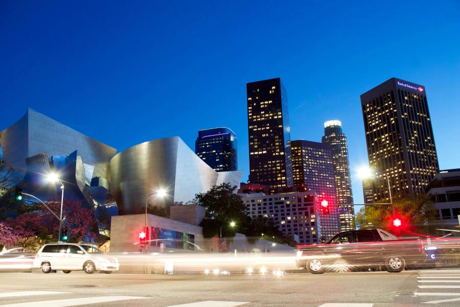 cityview of downtown los angeles with skyscrapers, blurred cars, and street lights