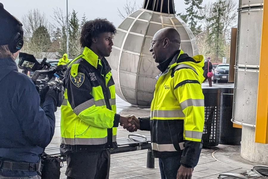 transit officer shaking hands