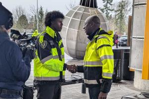 transit officer shaking hands