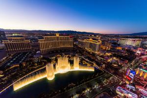 overview of las vegas at night with fountains lit up