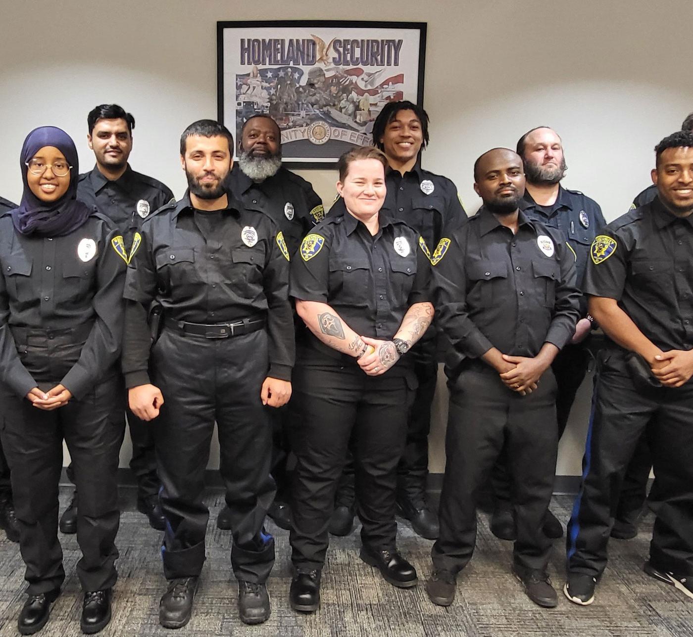 11 security officers in black uniforms