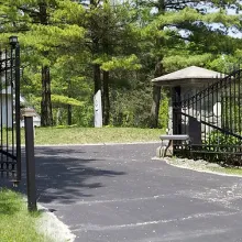 driveway gates open to a gated community