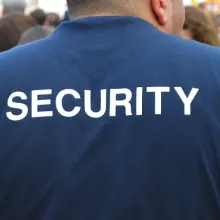 back of security officer shirt with text "security" written in capital letters