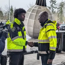 transit officer shaking hands