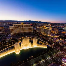overview of las vegas at night with fountains lit up