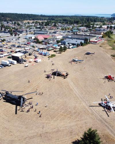 overview of unity of effort celebration with helicopters and vehicles