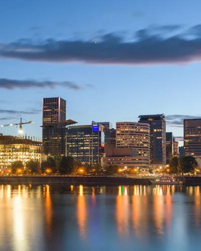 scenic view of downtown portland oregon with lights reflecting in water