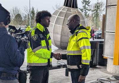 transit officer shaking hands